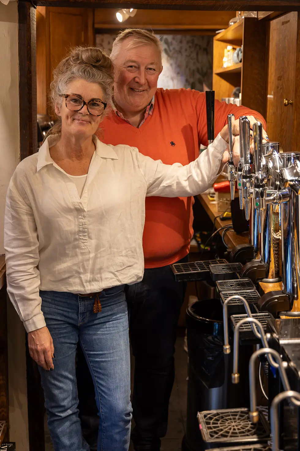 Landlords Ian and Tracy Holt behind the bar at the Rose & Crown, Ashdon