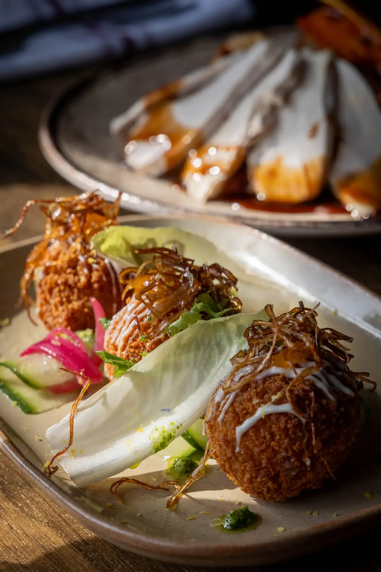 Smoked haddock & spring onion croquettes with lemon mayo, pickled radish, chicory and crispy garnish